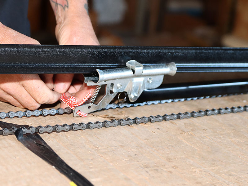 Garage door chain and track repair by garage door technician.